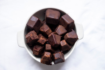 pure cocoa pastes inside white bowl