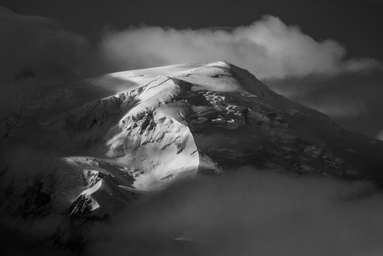 Dome du Gouter rising out of the clouds, Mont Blan