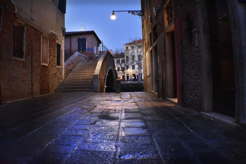 Photo of street and bridge of Venice