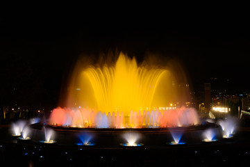 The colorful water show of Magic Fountain of Montjuic with light and music in Barcelona , Spain