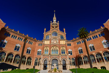 Fototapeta na wymiar Hospital of the Holy Cross and Saint Paul (Hospital de la Santa Creu i Sant Pau) by Domènech, a UNESCO World Heritage Site in Barcelona, Spain