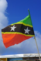 Flag of the Federation of St Kitts and Nevis floating in the wind