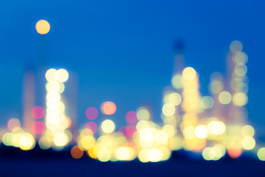 Abstract blur bokeh of oil gas refinery plant. May called petroleum, production or petrochemical plant. Industrial factory and engineering technology at night for business of power energy background.