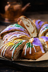 King cake for Mardi Gras, New Orlean traditional pastry with a plastic baby © fahrwasser