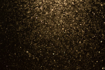 Fototapeta na wymiar Golden glitter bokeh of light.Abstract blurred light