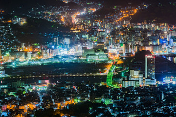 View of Nagasaki city at night taken by telephoto lens from Mount Inasa observation platform (Nagasaki, Japan)