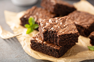 Freshly baked homemade brownies on a parchment paper