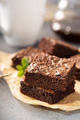 Freshly baked homemade brownies on a parchment paper