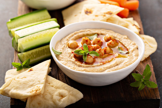 Homemade Hummus Served With Flatbread And Vegetables