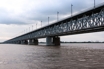 Russia, Khabarovsk, August 2019: Road bridge on the Amur river in the city of Khabarovsk in the summer