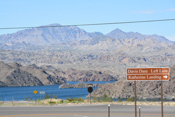 Davis Dam Sign and a Katherine Landing Sign over the border of Arizona and Nevada on Mohave Lake....