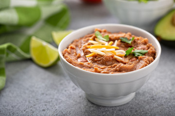 Refried beans in a white bowl, mexican dish