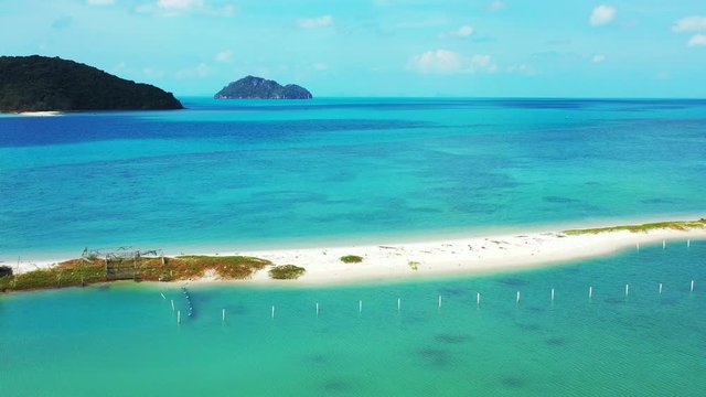 Small sandbank beach Ao Nai Wok, Koh Phangan. Thailand. Koh Tao and Ko tae Nai islands in the background
