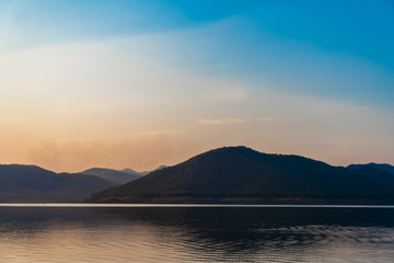 Scenery lake and mountain with sunset for holiday