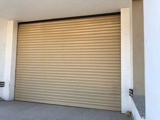Beige color Mechanic or Hydraulic operated rolling shutter for an shop or garage or storage yard of...