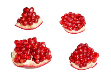 Pomegranate slices with juicy grains isolated on white background