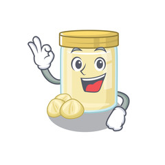 A funny picture of macadamia nut butter making an Okay gesture