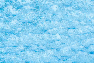 blue texture of an snow surface with pure ice white wave , blue cold clear cryslallized wall background ,decorative plaster background close up , abstract macro wallpaper