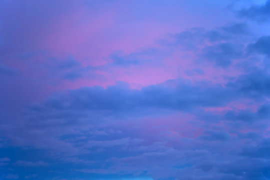 Background image of sky with clouds. Evening sunset. Blue and pink clouds.