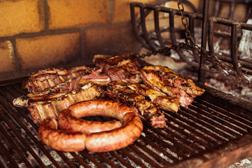 "Parrillada" Argentine barbecue make on live coal (no flame), beef "asado", bread, "Chorizo" and blood sausage "morcilla"