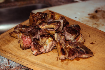 Roasted sliced barbecue meat ribs, focus on sliced meat.