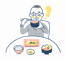 食事をする高齢男性