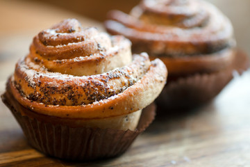poppy muffins on wooden table