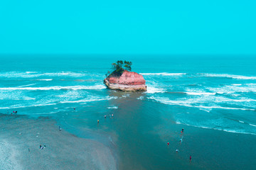 scenery on the beach using drones with blue sea and small islands