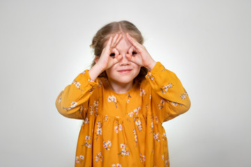 Finger glasses make a little girl blonde funny