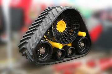 Components of agricultural machines. Track system. Back background blurred.