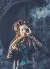 Beautiful steampunk teen girl  a gun