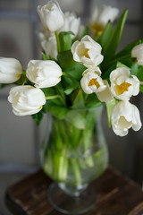 vase with a bouquet of flowers white tulips