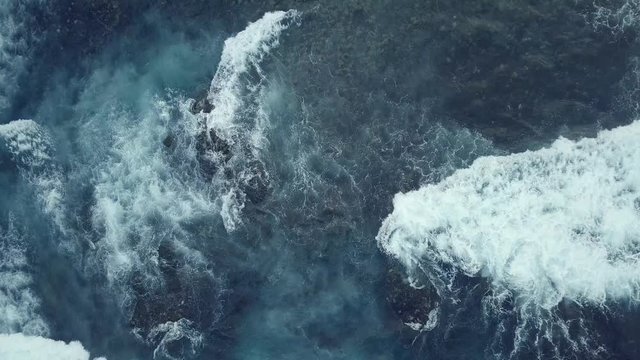 Aerial view of Atlantic ocean with crashing waves.