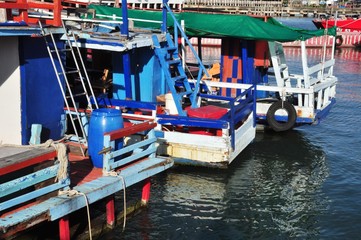 Fototapeta na wymiar View of Thai fishing port on a clear bright day.