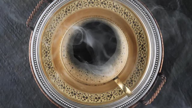 Cup of hot coffee with smoke 