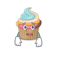 A picture of rainbow cupcake having an afraid face