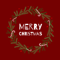 Spruce wreath wreath decorated with Christmas candies and dainty berries with the inscription 