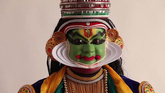 Close up of a Kathakali dancer expressing Sringara through his eyes.  