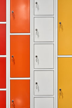 Closeup view at multicolored lockers with keys