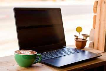 Notebook and coffee mugs in the office