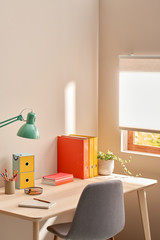 Desk with colorful stationery in corner