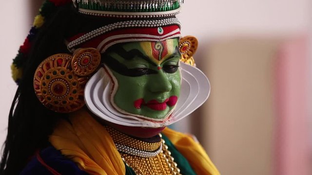 Kathakali dancer playing with his eyes and eyebrows. 