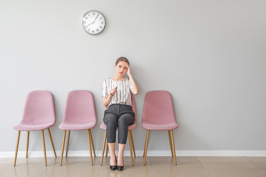Young woman waiting for job interview indoors