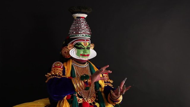 Kathakali dancer performing an act with his eyes and fingers. 