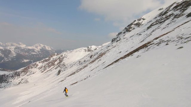 following good skier skiing in short turns off piste in winter mountains 