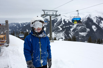 Fototapeta na wymiar Family, skiing in winter ski resort on a sunny day, enjoying nature