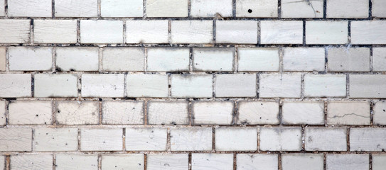 Old small tiles square shape on a wall