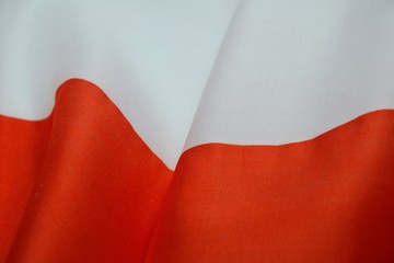 Flag of Poland. Polish flag, texture, fabric background. Polish flag waving in the wind - closeup. Concept for politics, election, sporting competitions, national events, independance day