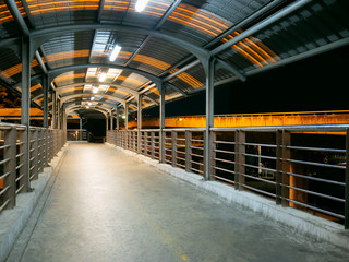 Walking on the overpass at night.