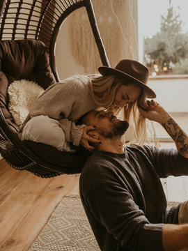Beautiful loving couple hugging each other and kissing, natural light and authentic emotion